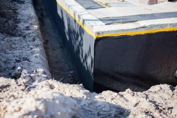 Professional Basement Waterproofing technician working in Verona, VA